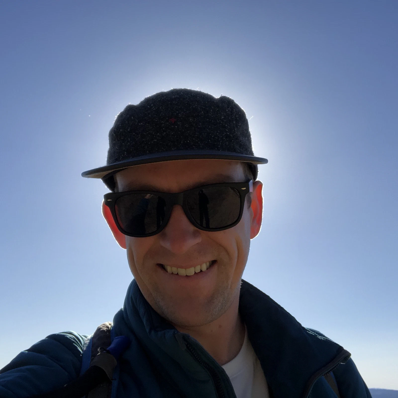 Ben Foden smiling, wearing sunglasses on a sunny day